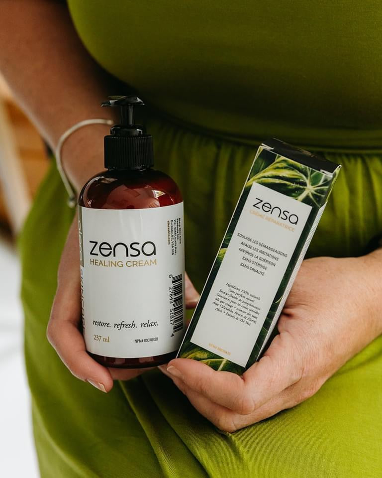 60ml & 237ml Zensa healing creams held by a woman in a green dress. Zensa Healing Cream 237ml pump bottle, 60ml in a green & white box. Designed for post-treatment care in aesthetic procedures.
