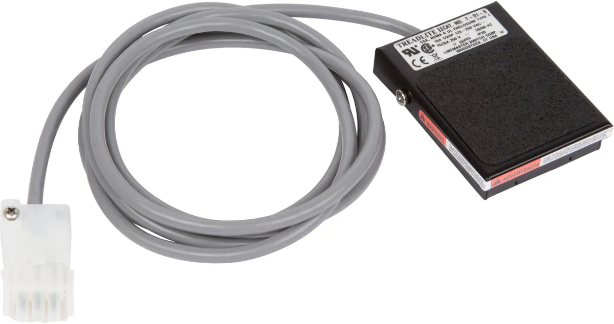 "A black rectangular foot pedal designed for use with Hinkel electrolysis machines, featuring a white rectangular plug. The pedal measures 3.5 inches by 2.5 inches by 0.75 inches and comes with a 90-inch cord for flexible use."