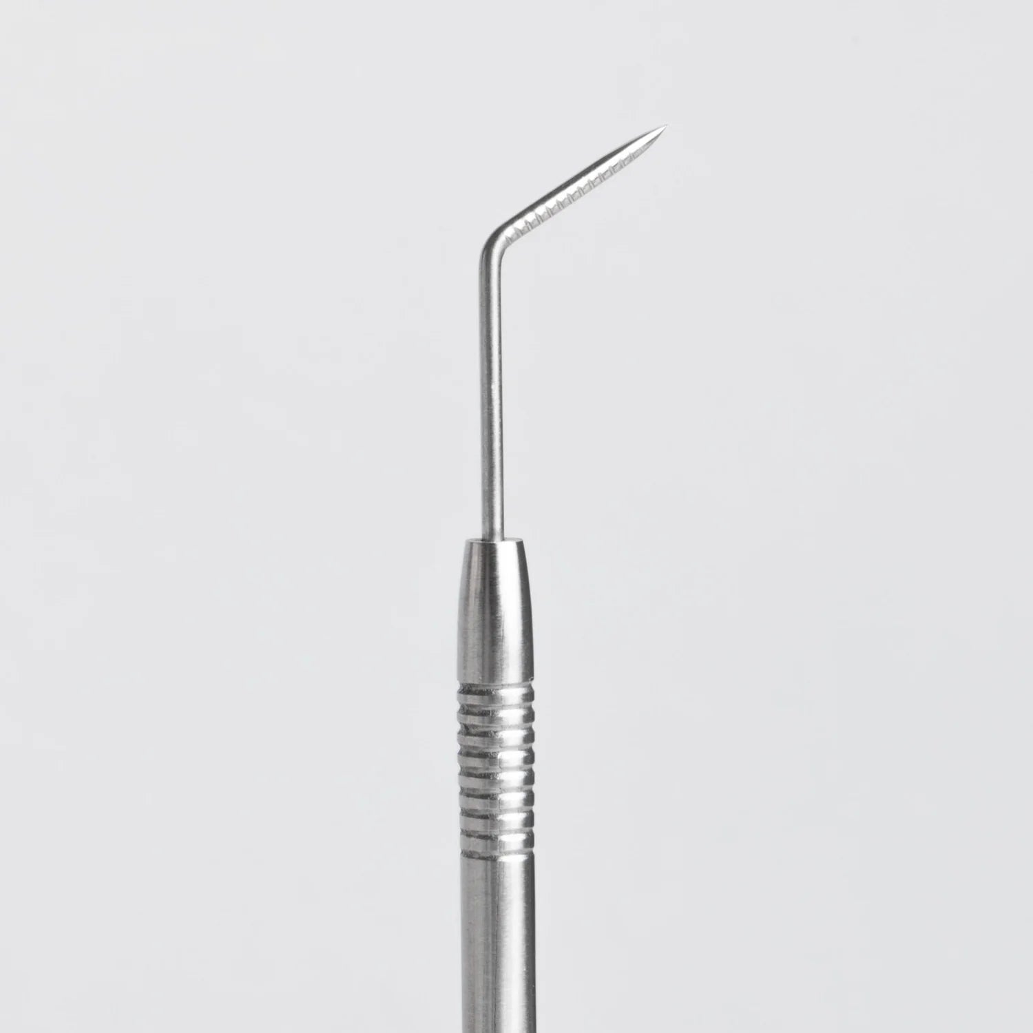 "Bee Pampered Precision Lash Lift Tool with fine tip for accurate lash separation, available at A & E Beauty Supplies. Silver tool on a white background"