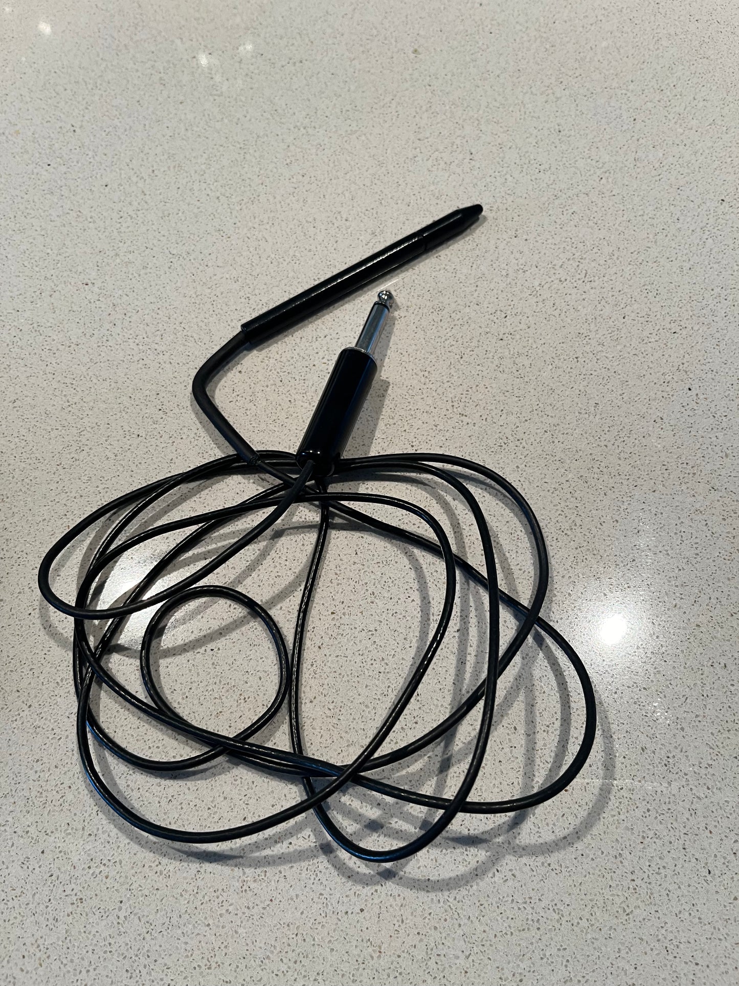 "A close-up of the F-shank short probeholder, used with Epileze electrolysis machines. The probeholder features a slim, straight handle with a secure grip, designed for precise control during electrolysis treatments."
