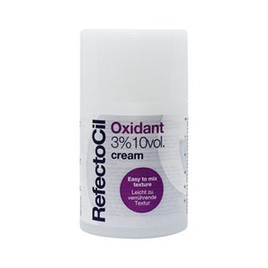 "A bottle of RefectoCil Oxidant Cream, 100ml, designed for use with brow and lash tints, featuring sleek white packaging with black and blue accents, displayed on a clean, neutral background."