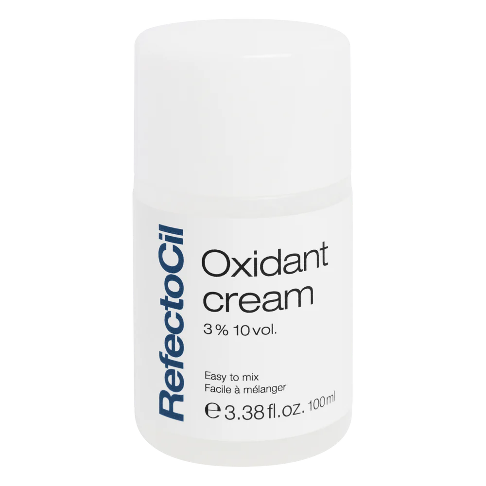 White 100ml bottle of RefectoCil Oxidant Cream with a blue label, designed for professional brow and lash tinting.
