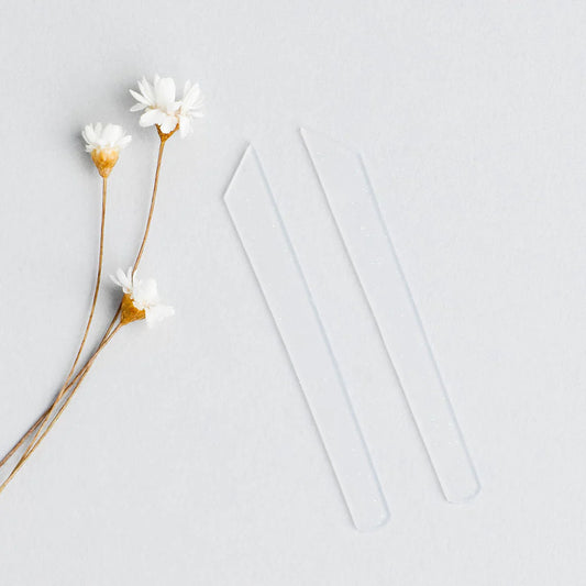 RefectoCil Silicone Lash Ribbons for precise and reusable lash lifts, available from A & E Beauty Supplies.Two ribbons with a few flowers on a clean white background