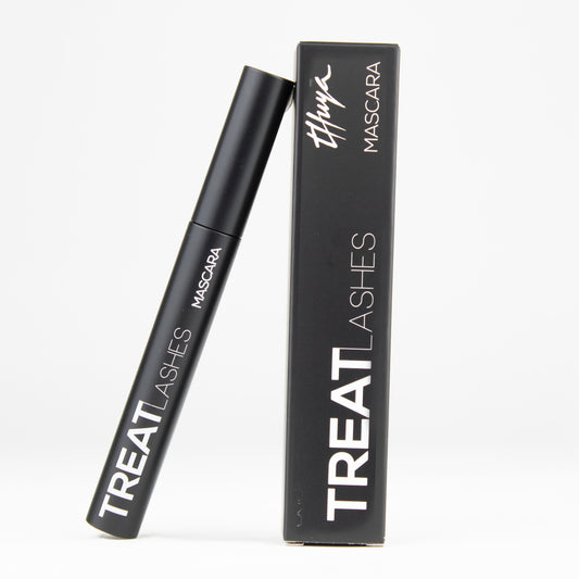 Thuya Treat Lashes Mascara with infinity-shaped brush for longer, stronger lashes, available at A & E Beauty Supplies. A sleek black packaging with white lettering