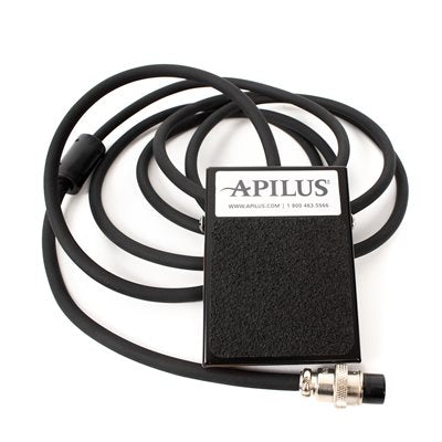 A rectangular black foot switch pedal designed for use with Apilus and Dectro electrolysis machines. The pedal features a smooth, durable surface with a non-slip texture to ensure secure activation. Ideal for hands-free operation, it is built to provide reliable performance during long electrolysis sessions.