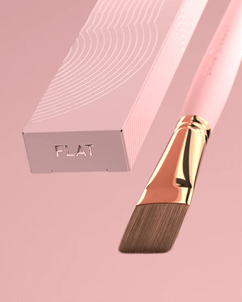 "Brow Daddy Framework Master Brush, available in 2 options, for precise application in brow makeup and microblading, displayed on a clean, pink background , brush aside a box"