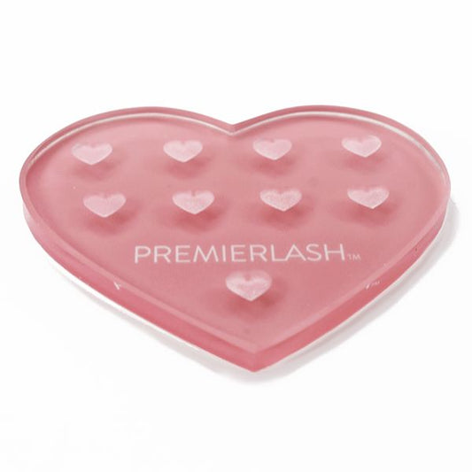 "Heart Shape Adhesive Crystal 1 Unit PremierLash - A & E Beauty Supplies
9 Wells for thin viscosity adhesive
Reverse side is a smooth, flat surface
Material:&nbsp; Glass
Reusable
To use:&nbsp; Clean with a PremierLash Adhesive Remover"