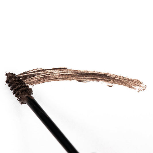 Thuya New Brow Intensifier 4ml for fuller, defined brows, nourishing and enhancing the natural brow color, available at A & E Beauty Supplies. Applicator applying the product on a clean white background in an eyebrow shape.