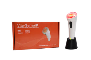 "Vitali-T Vita Sensa IR facial stimulator, with a white handle and red accents, designed for infrared light therapy. The device includes 21 LED diodes, with 16 infrared (875nm) and 5 red (660nm) diodes, positioned on the device’s head. The product is displayed alongside its accessories: a transformer, adapters, base, user guide, and travel kit. The overall device is ergonomic and sleek."